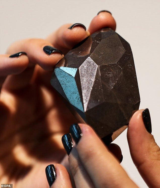 Black 555.55-carat formed 2 billion years ago sells for $4.28 million at auction