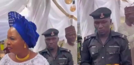 Viral video of police officer holding a plate of food for his madam at a party