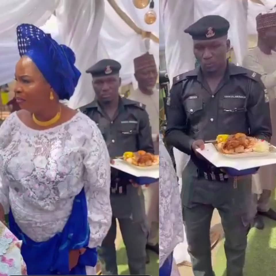 Viral video of police officer holding a plate of food for his madam at a party