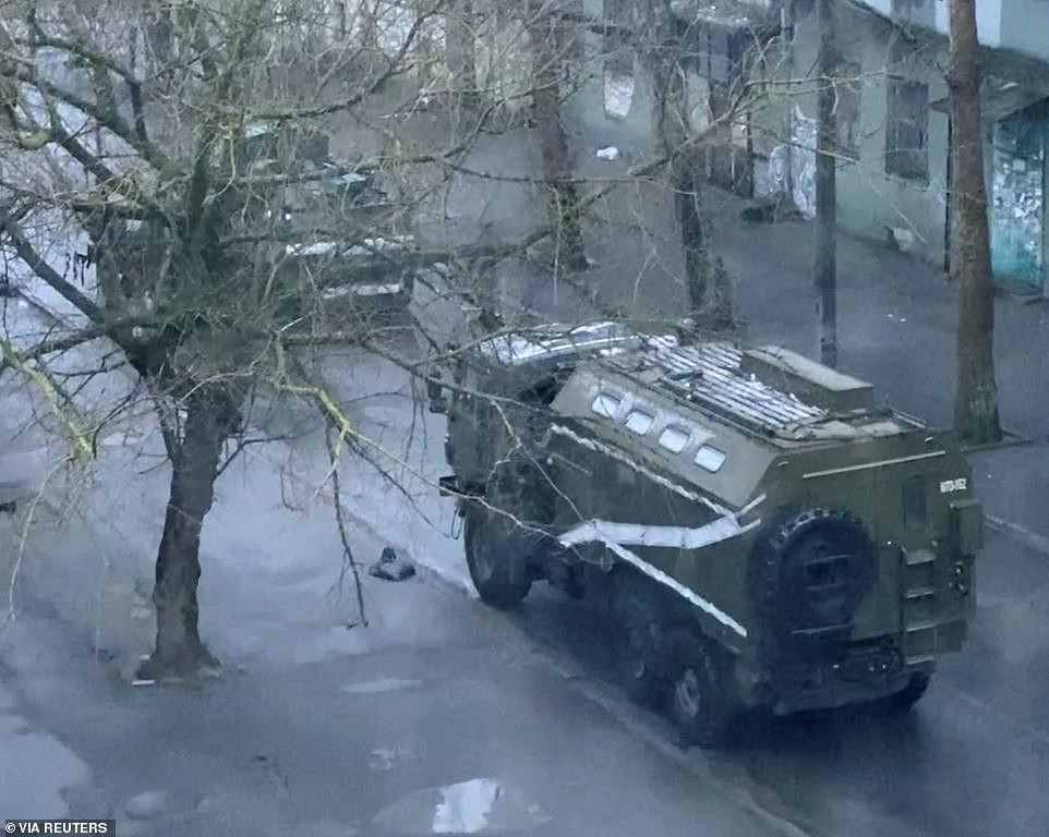 First major Ukranian city falls to Russian forces as city Mayor tells residents to obey Putin's soldiers and begs troops not to shoot civilians