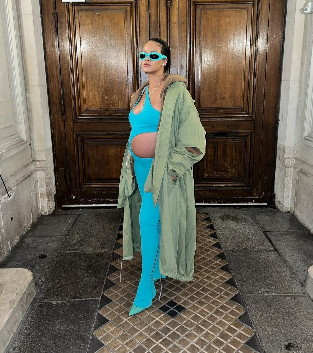 Rihanna steps out in a cut-out jumpsuit that put her bump on display at Paris Fashion Week (photos)