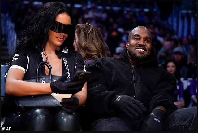 Kanye West all smiles as he sits courtside with his new girlfriend Chaney Jones at the Lakers after ex Kim Kardashian made her relationship with Pete Davidson Instagram official (photos)