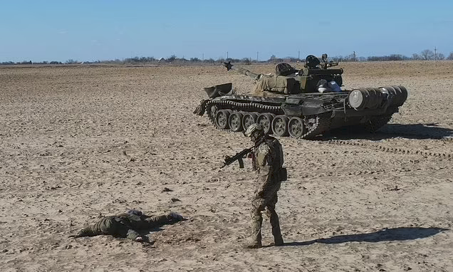 Russian soldier surrenders with tank in return for $10,000 and Ukrainian citizenship after his colleagues ran off and his commander threatened to shoot him'