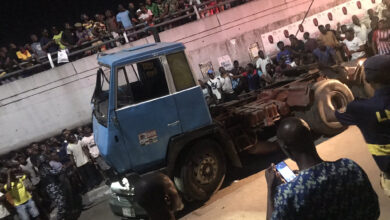 Many feared dead as trailer falls from bridge and lands on a car in Ojuelegba