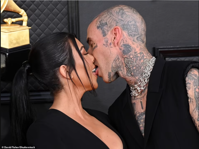 Grammys 2022: Kourtney Kardashian tongue-kisses Travis Barker on the red carpet as they pack on the PDA (photos)