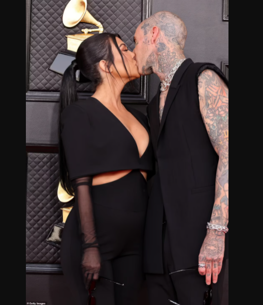 Grammys 2022: Kourtney Kardashian tongue-kisses Travis Barker on the red carpet as they pack on the PDA (photos)
