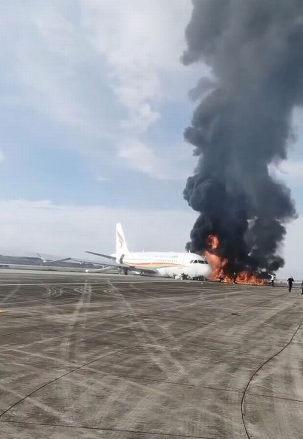 Plane carrying 122 passengers bursts into flames on runway during take-off