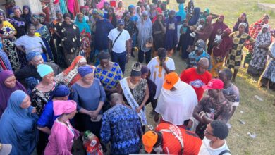 Miss Nollywood international winner Hassana Ozohu Salisu distributes Mini Bags of Rice to flood victims in Kogi state.