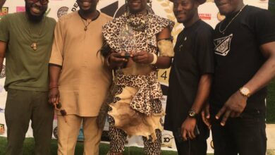 Felt Like Slim Version Of Don Jazzy, Varsity Lecturer Gushes Over Reception From Ex-students After 10 Years as he appears on his TourGecko regalia (video)*